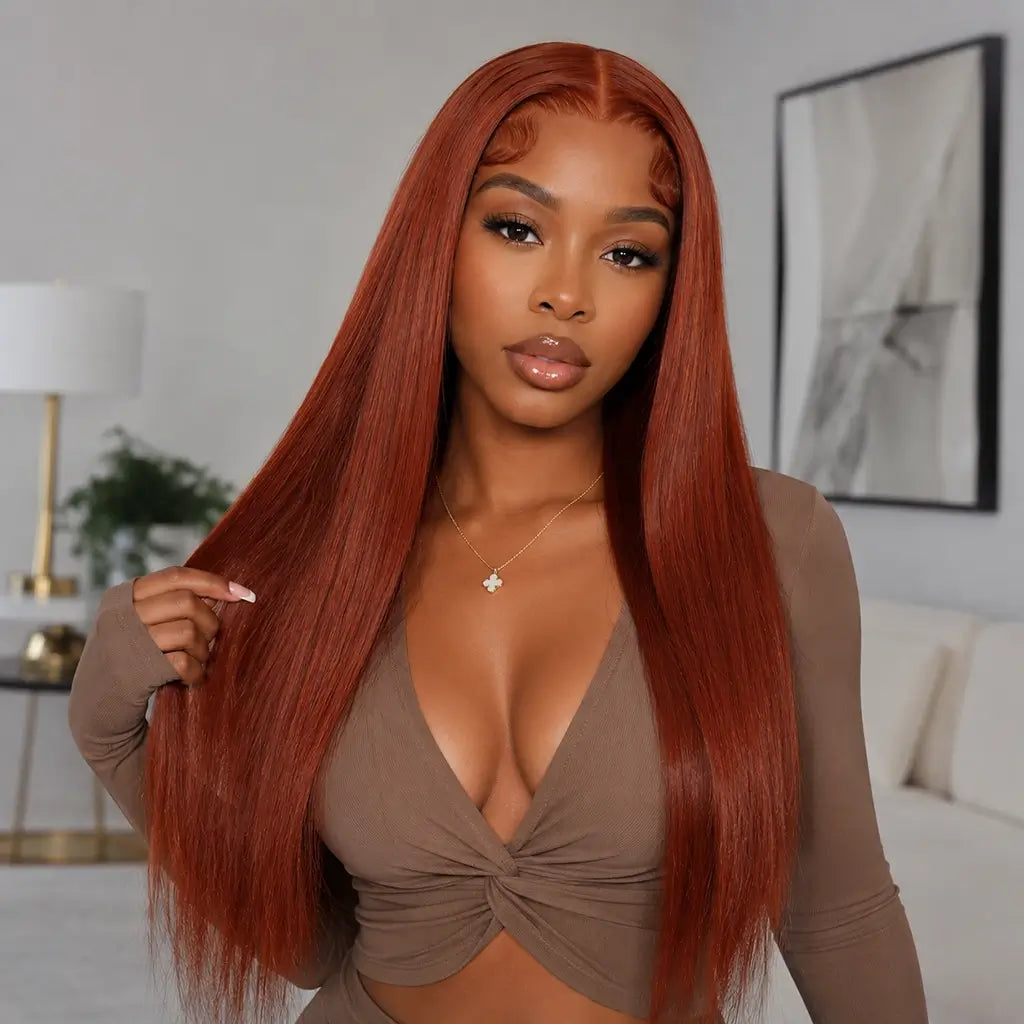 Woman with long straight reddish brown wig in a neutral-toned room