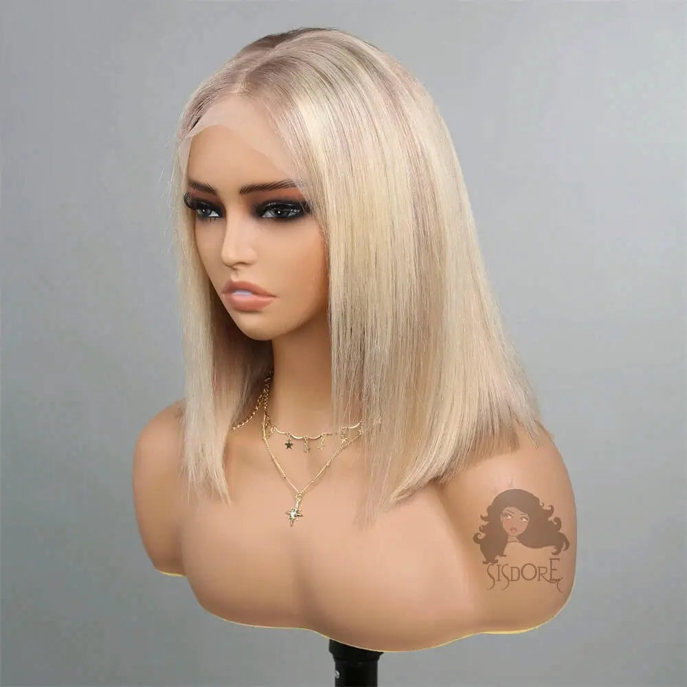 Mannequin head with a platinum blonde wig on a gray background