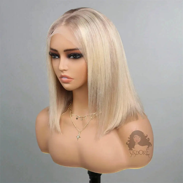 Mannequin head with a platinum blonde wig on a gray background