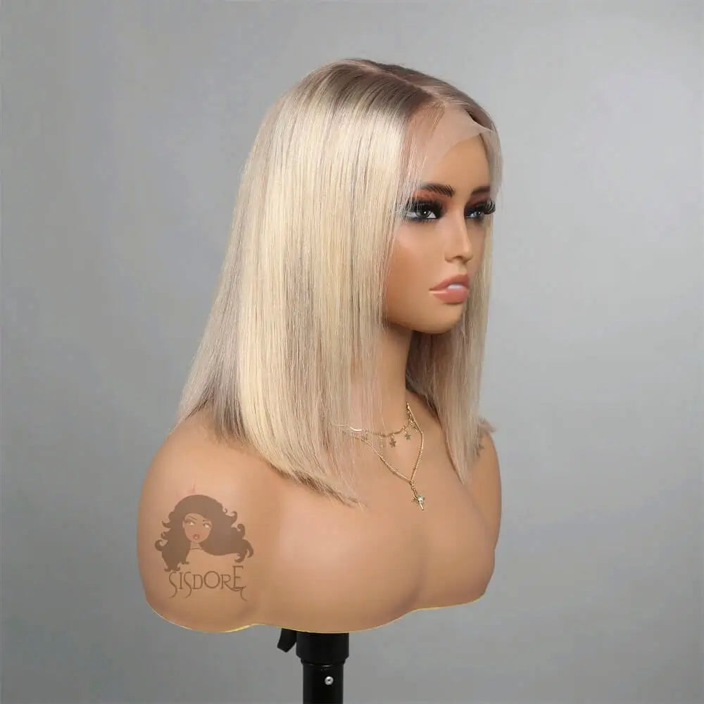 Side view of a short platinum blonde straight bob wig with dark roots